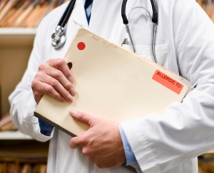 doctor holding medical records